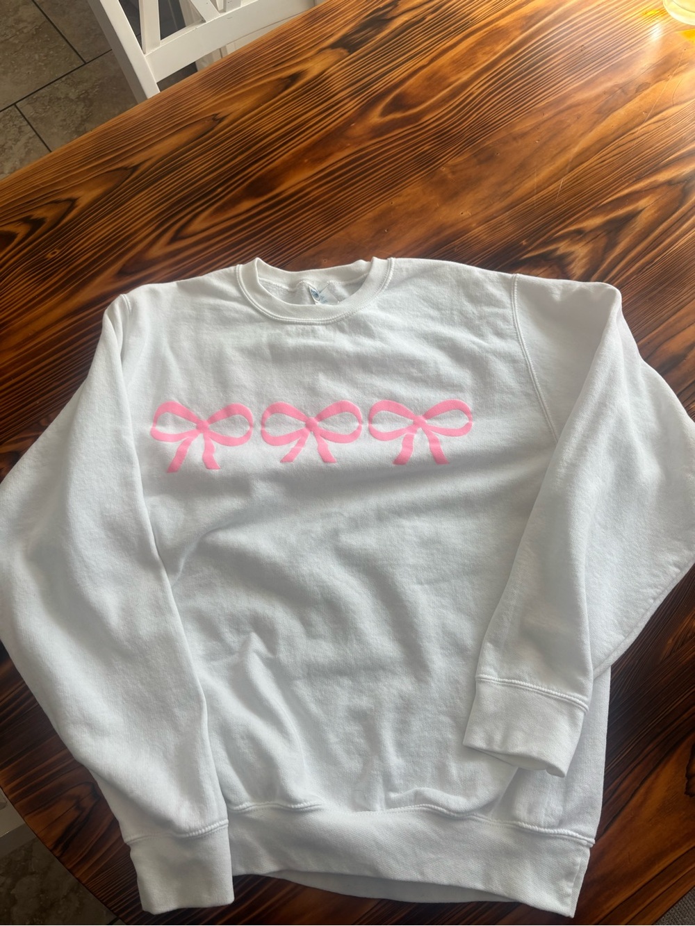 Port and Company White Crewneck Sweater with Pink Bow Graphics